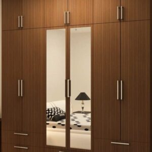 Bedroom fixed-in wall wardrobe with cabinets, drawers and mirrors