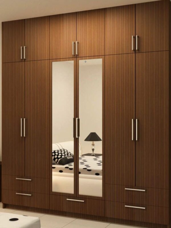 Bedroom fixed-in wall wardrobe with cabinets, drawers and mirrors